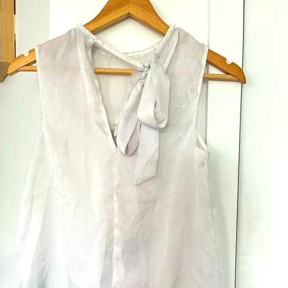 #90 🌺 5/$30 🌺 White Beaded neckline sleeveless top with tie back - Picture 1 of 8